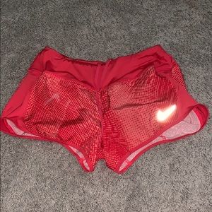 red nike shorts